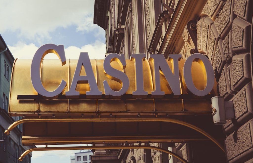 Shallow focus photo of Casino signage — 747.live Casino