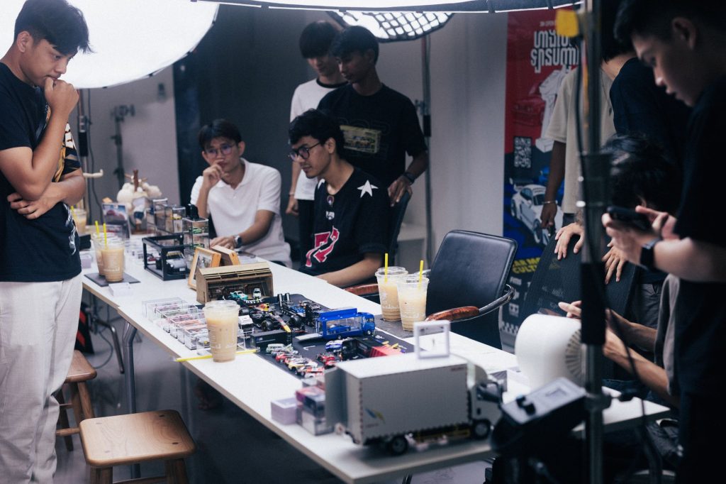 Group of young adults engaged in a diecast model gathering in Phnom Penh, Cambodia. — Datablitz