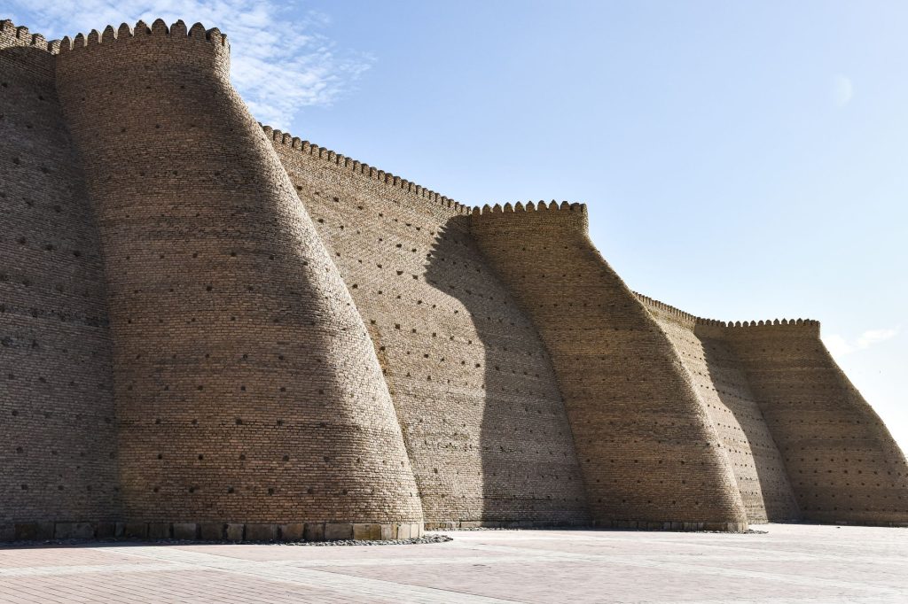 Architectural detail of the historic Ark Fortress walls in Bukhara, Uzbekistan. — Kayatan.com