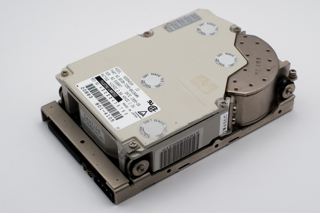 An old computer hard drive, showcasing vintage technology and retro hardware design. — S888