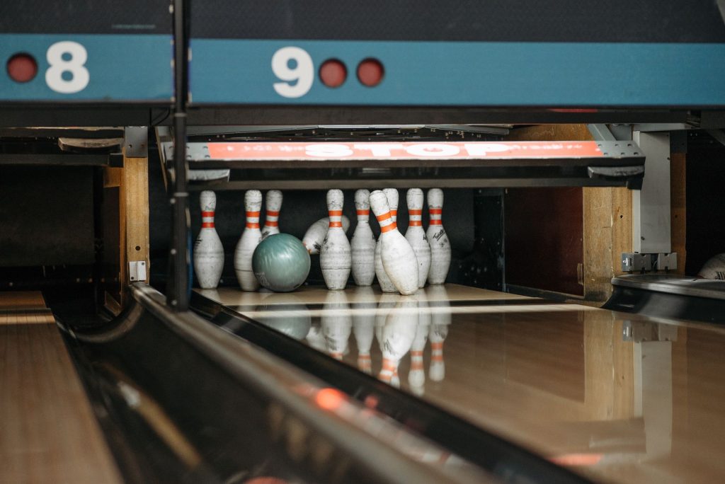 A bowling ball ready to knock down pins at a lively bowling alley. — Stl Result Today
