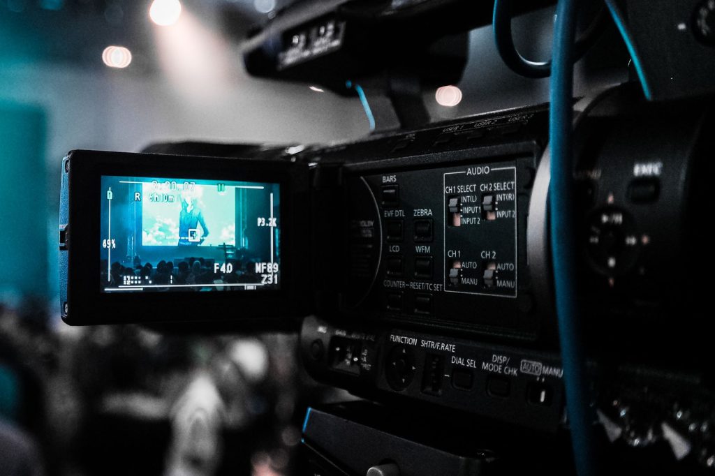 HD video camera capturing a live event; focus on screen and controls. — Xvideo2